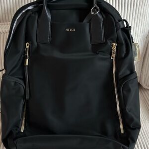 Tumi Black Voyager Atlanta Backpack with Gold Accents